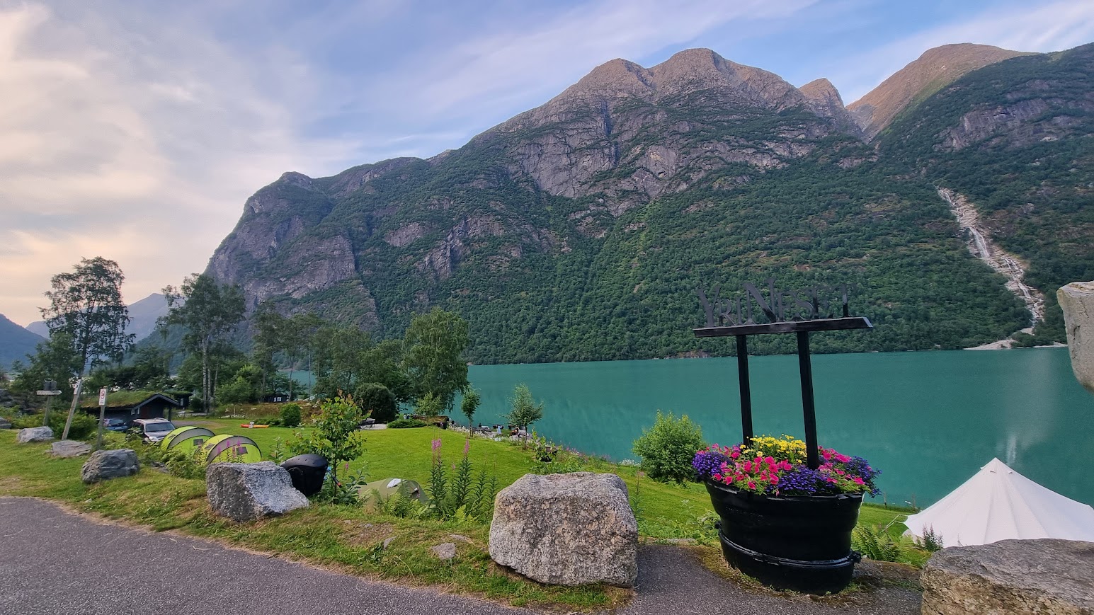 The emerald-green waters of Oldevatnet in the glacier-carved valley of Oldedalen