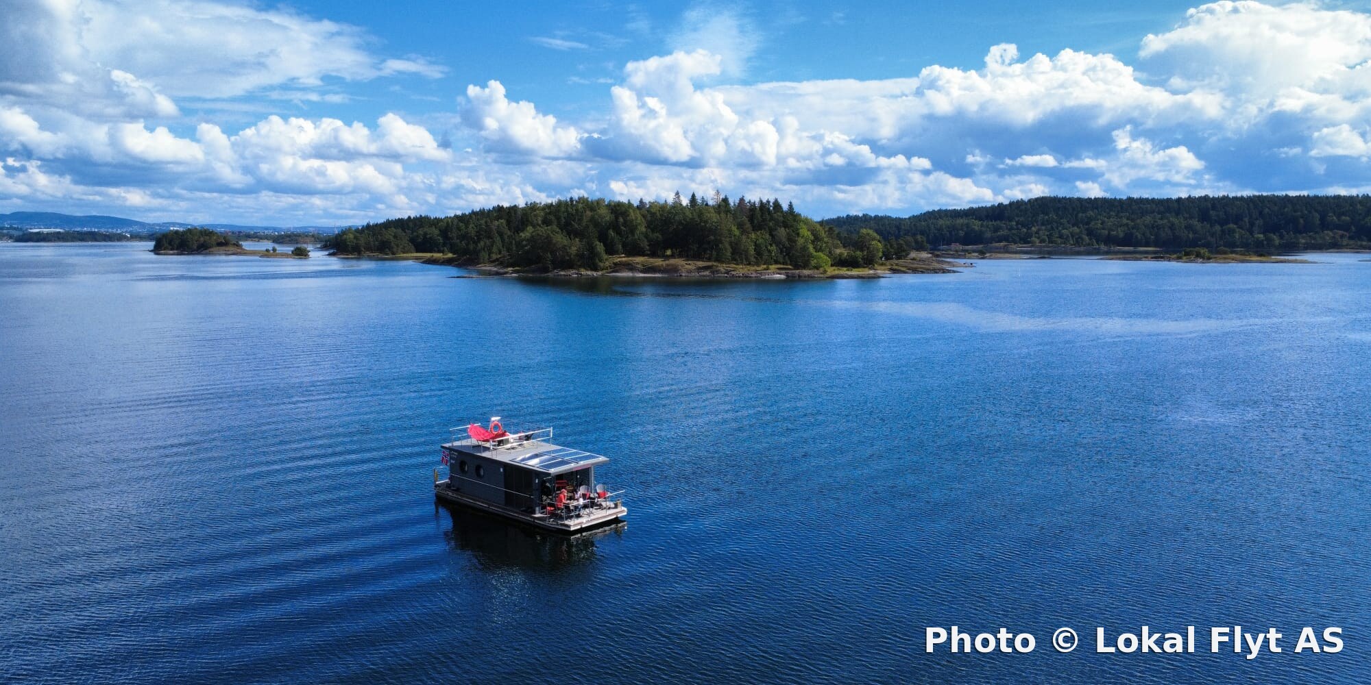 Electric houseboat on the Oslo Fjord seen from a distance